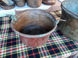 Group of three large antique copper pots